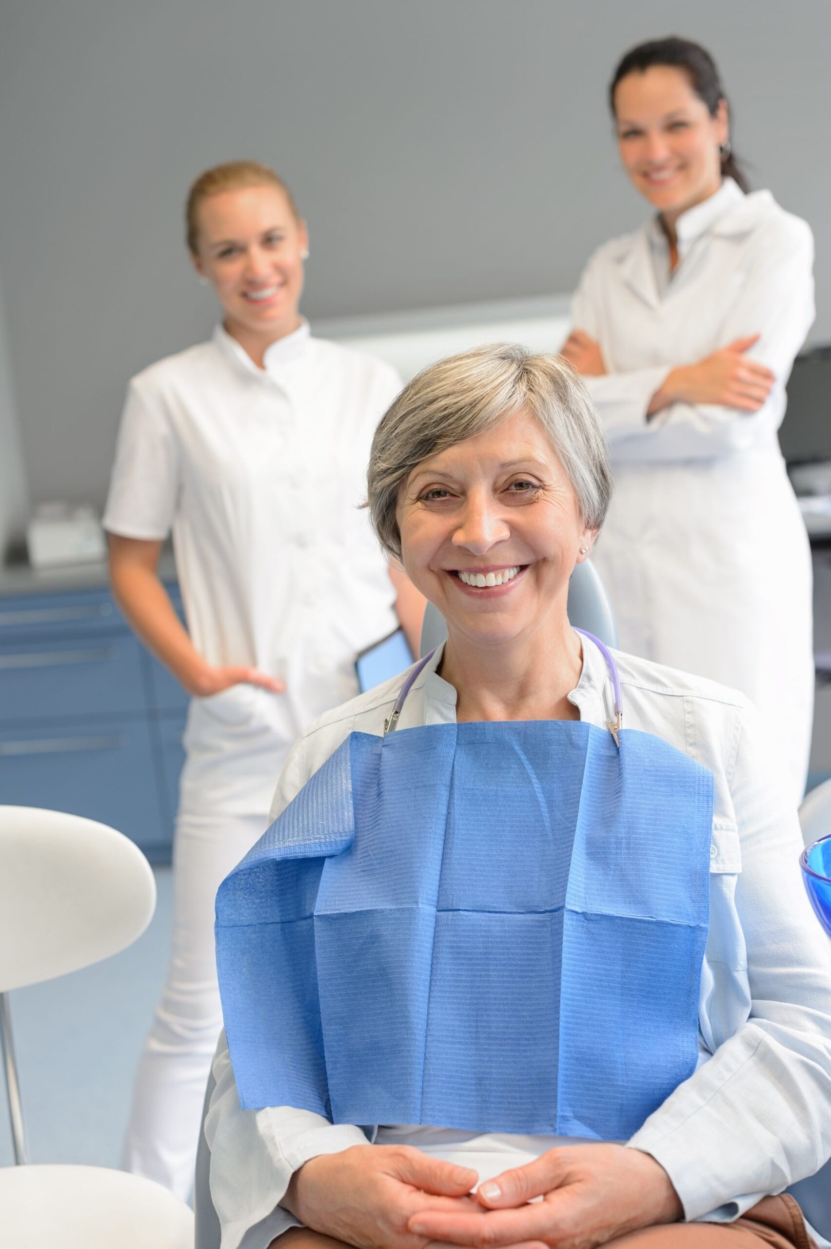 patient with professional dentist team